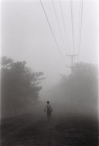 Person runs into the fog