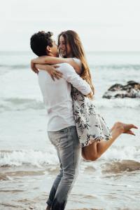 A couple hugging on the beach